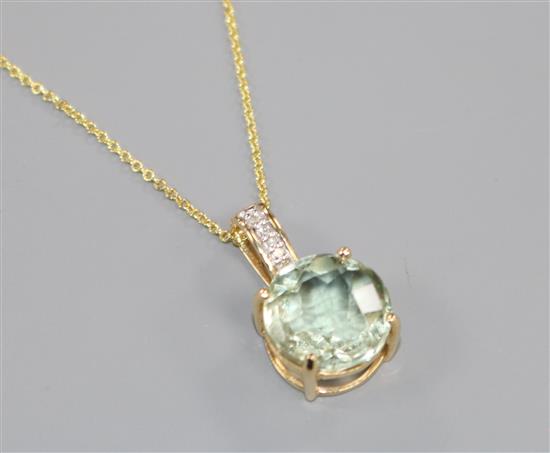 A 14ct gold, aquamarine? and diamond set pendant, on a 14ct gold fine link chain, pendant 19mm.